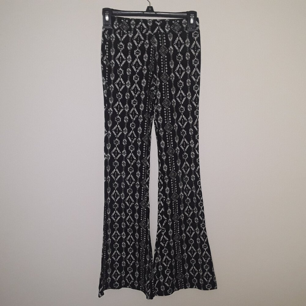Justice girls size 14 black/white pattern,stretchy logo pants w/flare bottoms